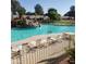 Inviting community pool with plenty of lounge chairs at 14371 W Morning Star Trl, Surprise, AZ 85374