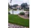 Relaxing water feature with a gazebo and lush landscaping at 14371 W Morning Star Trl, Surprise, AZ 85374