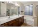 Elegant bathroom with double vanity and soaking tub at 15450 W Tasha Cir, Surprise, AZ 85374