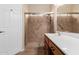 Bathroom boasts double sinks, a walk-in shower, and tile flooring at 15491 W Amelia Dr, Goodyear, AZ 85395