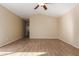 Spacious bedroom with tile flooring and ceiling fan at 15491 W Amelia Dr, Goodyear, AZ 85395