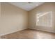 Spacious bedroom with tile floors and window with blinds at 15491 W Amelia Dr, Goodyear, AZ 85395