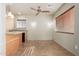 Common area with wet bar and ceiling fan at 15491 W Amelia Dr, Goodyear, AZ 85395