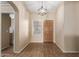 Home entry with wood door and tile flooring at 15491 W Amelia Dr, Goodyear, AZ 85395