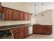 Well-equipped kitchen with stainless steel appliances and wood cabinets at 15491 W Amelia Dr, Goodyear, AZ 85395