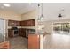 Updated kitchen with stainless steel appliances and granite counters at 15491 W Amelia Dr, Goodyear, AZ 85395