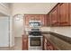 Kitchen features stainless steel appliances and granite countertops at 15491 W Amelia Dr, Goodyear, AZ 85395