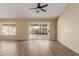Bright living room with tile floors and sliding glass door leading to backyard at 15491 W Amelia Dr, Goodyear, AZ 85395