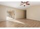 Bright living room featuring tile floors and sliding glass door leading to patio at 15491 W Amelia Dr, Goodyear, AZ 85395