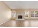 Living room with tile flooring and a white fireplace at 15491 W Amelia Dr, Goodyear, AZ 85395