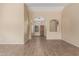 Open living room with tile flooring and high ceilings at 15491 W Amelia Dr, Goodyear, AZ 85395