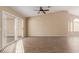 Living room with tile flooring and sliding glass doors at 15491 W Amelia Dr, Goodyear, AZ 85395