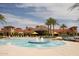 Community pool with spa and fountains; Mediterranean-style architecture at 15856 W Sage Trl, Surprise, AZ 85374