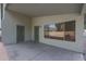 Covered back patio with access door and window at 16796 W Pierce St, Goodyear, AZ 85338