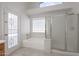 Bathroom with shower, tub, and double sinks at 16796 W Pierce St, Goodyear, AZ 85338