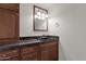 Bathroom with dark wood cabinets and a black sink at 1777 W Ocotillo Rd # 23, Chandler, AZ 85248