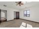 Spacious bedroom with ceiling fan and large window at 1777 W Ocotillo Rd # 23, Chandler, AZ 85248