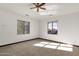 Bright bedroom with two windows and ceiling fan at 1777 W Ocotillo Rd # 23, Chandler, AZ 85248