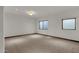 Spacious bedroom with carpet, two windows, and recessed lighting at 1777 W Ocotillo Rd # 23, Chandler, AZ 85248