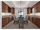 Formal dining room with built-in cabinetry and large window at 1777 W Ocotillo Rd # 23, Chandler, AZ 85248
