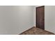 A simple hallway with tile flooring and a door at 1777 W Ocotillo Rd # 23, Chandler, AZ 85248