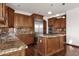 Kitchen with island, stainless steel appliances, and wood cabinetry at 1777 W Ocotillo Rd # 23, Chandler, AZ 85248