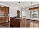 Island kitchen with granite countertops and dark wood cabinets at 1777 W Ocotillo Rd # 23, Chandler, AZ 85248