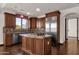 Kitchen with island, stainless steel appliances, and wood cabinetry at 1777 W Ocotillo Rd # 23, Chandler, AZ 85248