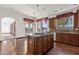 Kitchen features granite counters, island, and hardwood floors at 1777 W Ocotillo Rd # 23, Chandler, AZ 85248
