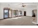Spacious living room with hardwood floors and access to a patio at 1777 W Ocotillo Rd # 23, Chandler, AZ 85248