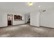 Open living area with carpet, a wet bar, and stairs at 1777 W Ocotillo Rd # 23, Chandler, AZ 85248