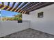 Private patio with pergola, tile flooring, and a view of lush trees at 1777 W Ocotillo Rd # 23, Chandler, AZ 85248