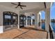 Covered patio overlooking a lake with tile flooring and ceiling fans at 1777 W Ocotillo Rd # 23, Chandler, AZ 85248