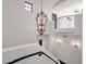 Grand staircase with ornate chandelier and wrought iron railing at 1777 W Ocotillo Rd # 23, Chandler, AZ 85248