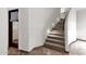 Modern staircase with carpet runner and ambient lighting at 1777 W Ocotillo Rd # 23, Chandler, AZ 85248