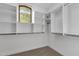 Spacious walk-in closet with ample shelving and hanging rods at 1777 W Ocotillo Rd # 23, Chandler, AZ 85248