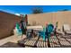 Backyard with fire pit, seating, and lawn area at 18188 W Fulton St, Goodyear, AZ 85338