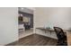 Home office with a desk, chair, and view into the entryway at 18188 W Fulton St, Goodyear, AZ 85338