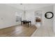 Bright dining room with hardwood floors and a view into the living room at 1911 S Saddle St, Gilbert, AZ 85233