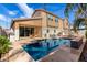 Spacious backyard with a refreshing pool, patio seating, and well-maintained landscaping at 1921 E Lantana Dr, Chandler, AZ 85286