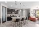 Gourmet kitchen with a large island, stainless steel appliances, and open layout to living area at 1921 E Lantana Dr, Chandler, AZ 85286