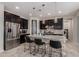 Modern kitchen with stainless steel appliances, granite countertops, and a center island at 1921 E Lantana Dr, Chandler, AZ 85286