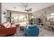 Stylish living room with a stone accent wall, sleek furniture, and open layout at 1921 E Lantana Dr, Chandler, AZ 85286