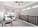 Bright loft area features a built-in desk and cozy seating area by the window at 1921 E Lantana Dr, Chandler, AZ 85286