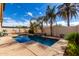 Serene backyard oasis featuring a sparkling pool, lounge chairs, and lush greenery at 1921 E Lantana Dr, Chandler, AZ 85286