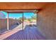 Covered patio and spacious backyard with gravel and desert landscaping at 19572 N Sandalwood Dr, Maricopa, AZ 85138