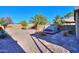 Landscaped backyard with a spa and a relaxing patio at 19572 N Sandalwood Dr, Maricopa, AZ 85138