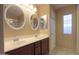 Bathroom with double vanity, large mirror, and separate shower and tub at 19572 N Sandalwood Dr, Maricopa, AZ 85138