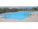 Community pool with ample deck space for lounging at 19572 N Sandalwood Dr, Maricopa, AZ 85138