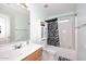 Clean bathroom with a tub shower, white vanity, and zebra print accents at 20031 N 22Nd Pl, Phoenix, AZ 85024